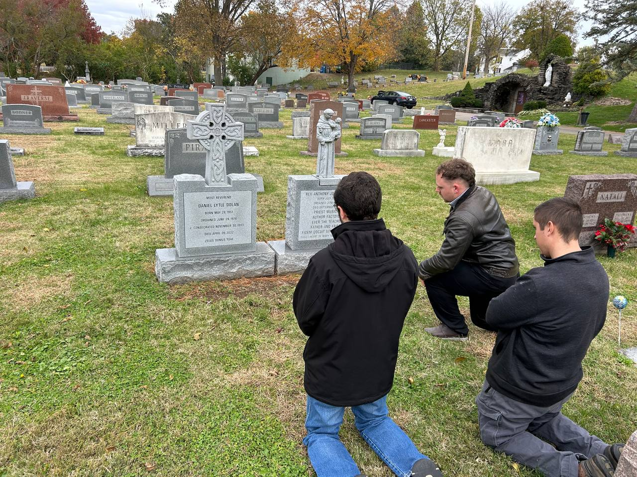 Praying at the graves of Bishop Dolan and Father Cekada.